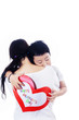 Photo: Boy hug mother holding love card on white Boy hug mother holding love card on white