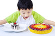 Photo: Excited boy looking at colorful desserts Excited boy looking at colorful desserts