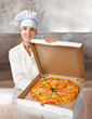 female cook with  pizza in box