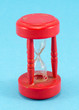 broken red sand glass clock on blue background