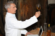 Photo: Oenologist analysing a wine Oenologist analysing a wine
