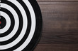 darts target on dark wooden background