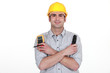 Electrician with voltmeter and clippers