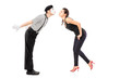 Full length portrait of a male mime artist and a young woman abo