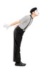 Full length portrait of a male mime artist gesture kissing