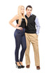 Full length portrait of a young couple standing together and loo