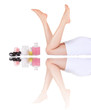 beautiful female legs and spa items with reflectionl