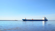 Cargo ship sailing in still water