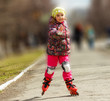 Girl riding on roller skates in the park