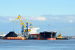 cargo ship loading in coal cargo terminal