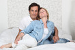 Couple hugging on a bed