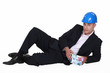Foto: confident entrepreneur lying on white background confident entrepreneur lying on white background