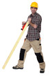 Photo: Tradesman smoothing a plank of wood Tradesman smoothing a plank of wood