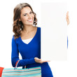 Photo: Woman with shopping bags and signboard, isolated Woman with shopping bags and signboard, isolated
