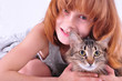 Photo: little girl hugging her cat little girl hugging her cat