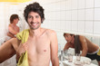 trio of male flatmates in bathroom