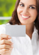 Businesswoman showing blank business card