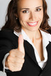 Businesswoman with thumbs up, over gray