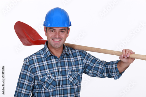 Photo: Builder resting shovel on shoulder Builder resting shovel on shoulder