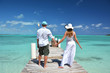 A couple on the wooden jetty. Exuma, Bahamas