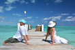 A couple on the wooden jetty. Exuma, Bahamas