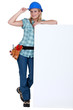 Female builder with a blank board