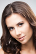 Portrait of beautiful woman, over grey