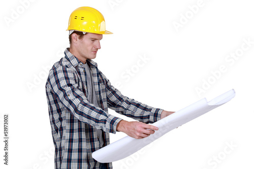 Photo: craftsman looking at a blueprint craftsman looking at a blueprint