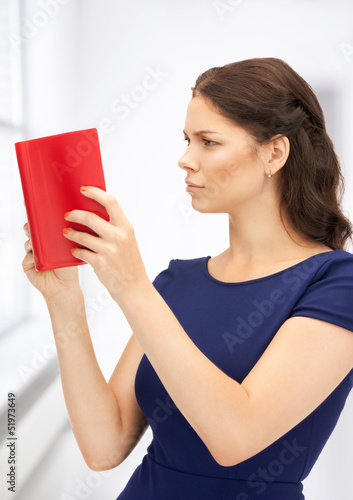 Photo: calm and serious woman with book calm and serious woman with book