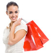 Photo: Young happy woman with shopping bags, isolated Young happy woman with shopping bags, isolated