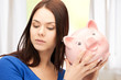 lovely woman with piggy bank