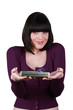 Woman with playful smile showing gift