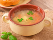 Chicken soup in the brown ceramic bowl