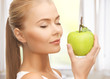 woman smelling apple