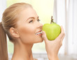 woman smelling apple