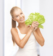woman holding lettuce