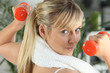 Photo: Woman with orange weights Woman with orange weights