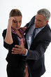 young woman having migraine comforted by mature gentleman