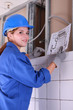 Photo: Female electrician looking at a diagram Female electrician looking at a diagram