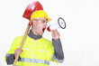 Foto: Worker with a spade screaming into a bullhorn Worker with a spade screaming into a bullhorn