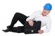Photo: senior architect lying on floor with briefcase senior architect lying on floor with briefcase