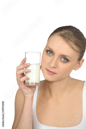 Photo: blonde woman drinking milk blonde woman drinking milk