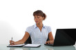Woman taking notes