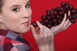 Photo: Woman eating grapes Woman eating grapes
