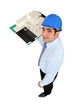 Photo: Man holding model housing Man holding model housing