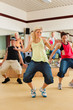 Photo: Zumba or Jazzdance - young people dancing in studio Zumba or Jazzdance - young people dancing in studio