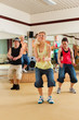 Photo: Zumba or Jazzdance - young people dancing in studio Zumba or Jazzdance - young people dancing in studio