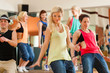 Zumba or Jazzdance - young people dancing in studio
