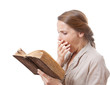 yawning girl reading a boring book, isolated on white