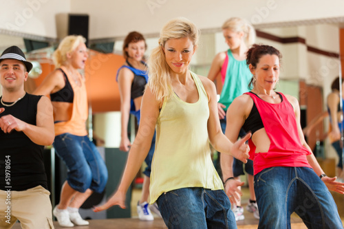 Photo: Zumba or Jazzdance - young people dancing in studio Zumba or Jazzdance - young people dancing in studio